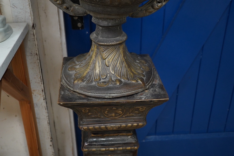 A large two colour bronze effect urn on pedestal, total height 134cm. Condition - fair to good